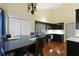 Eat-in kitchen featuring stainless steel appliances, dark cabinetry, and ample counter space at 3438 Farmers Market Dr, Charleston, SC 29414