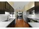 Charming kitchen boasts stainless steel appliances, dark wood cabinets, and an adjacent dining area, creating a warm and inviting space at 3438 Farmers Market Dr, Charleston, SC 29414
