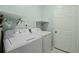 Functional laundry room equipped with a washer, dryer, and storage shelves for efficient organization at 3438 Farmers Market Dr, Charleston, SC 29414