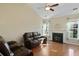 Living room showcasing natural light, a cozy fireplace, and hardwood flooring at 3438 Farmers Market Dr, Charleston, SC 29414