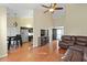 Open-concept living area with hardwood floors and seamless flow to the kitchen at 3438 Farmers Market Dr, Charleston, SC 29414