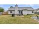 Spacious backyard with a dining set and a fire pit area, perfect for outdoor gatherings at 346 Courtney Round, Summerville, SC 29483