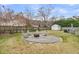 Cozy backyard with a gravel fire pit area and seating, complemented by a storage shed at 346 Courtney Round, Summerville, SC 29483