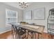 Cozy dining room features a rustic table, industrial-style chairs, and plenty of natural light from a large window at 346 Courtney Round, Summerville, SC 29483