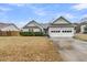 Pleasant single-story residence with a two-car garage and well-kept lawn, perfect for suburban living at 346 Courtney Round, Summerville, SC 29483