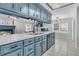 Bright kitchen with blue cabinetry, a large island, and a seamless connection to the living and dining spaces at 346 Courtney Round, Summerville, SC 29483