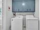 Functional laundry room with modern appliances and plenty of storage space above at 346 Courtney Round, Summerville, SC 29483