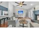 Spacious living room showcases hardwood floors, vaulted ceilings, a fireplace, and seamless access to the kitchen at 346 Courtney Round, Summerville, SC 29483