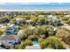This aerial view features a coastal community with beach access and ocean views, plus swimming pools at 4006 Hartnett Blvd, Isle of Palms, SC 29451