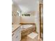 Bright bathroom with bathtub with tile surround, and a glass door shower at 4006 Hartnett Blvd, Isle of Palms, SC 29451