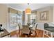 Bright breakfast nook with natural light, hardwood floors and views of the landscaped yard at 4006 Hartnett Blvd, Isle of Palms, SC 29451