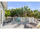 Outdoor deck with a grill and lounge chairs, perfect for entertaining at 4006 Hartnett Blvd, Isle of Palms, SC 29451