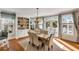 Elegant dining area with natural light, hardwood floors, a built-in hutch and a walkout to outdoor living at 4006 Hartnett Blvd, Isle of Palms, SC 29451