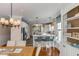 Bright kitchen with a breakfast bar, stainless appliances, and modern lighting at 4006 Hartnett Blvd, Isle of Palms, SC 29451