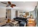 This living room offers hardwood floors, a ceiling fan, and plenty of natural light at 4006 Hartnett Blvd, Isle of Palms, SC 29451