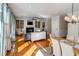 Sunlit living room featuring a fireplace, built-in shelves, and a dining area at 4006 Hartnett Blvd, Isle of Palms, SC 29451