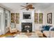 Inviting living room showcasing a fireplace and custom built-in bookshelves at 4006 Hartnett Blvd, Isle of Palms, SC 29451