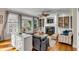 Cozy living room features a fireplace, built-in shelving, and hardwood flooring at 4006 Hartnett Blvd, Isle of Palms, SC 29451