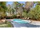 A tranquil backyard featuring a swimming pool with lounge chairs for relaxation at 4006 Hartnett Blvd, Isle of Palms, SC 29451