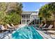 Backyard featuring a pool, deck, and lounging area for relaxation at 4006 Hartnett Blvd, Isle of Palms, SC 29451