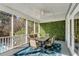 Relaxing screened porch with a dining table and a view of the backyard at 4006 Hartnett Blvd, Isle of Palms, SC 29451