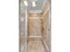 Tiled shower with glass doors, dual shower heads and a built in shower bench at 4006 Hartnett Blvd, Isle of Palms, SC 29451