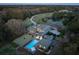 Aerial view of property with a pool, private drive, and lush landscaping at 4020 Betsy Kerrison Pkwy, Johns Island, SC 29455