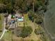 Lush estate with a modern house, pool, and waterfront views surrounded by trees at 4020 Betsy Kerrison Pkwy, Johns Island, SC 29455