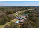 Picturesque aerial view featuring a grand estate with a pool, pond, and trees at 4020 Betsy Kerrison Pkwy, Johns Island, SC 29455
