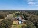 Stunning aerial view showcasing vast estate with a pool, pond, and lush trees at 4020 Betsy Kerrison Pkwy, Johns Island, SC 29455