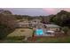 Twilight aerial shot of estate with pool, guesthouse and professionally landscaped grounds at 4020 Betsy Kerrison Pkwy, Johns Island, SC 29455