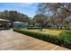 An expansive outdoor deck provides direct access to a backyard featuring a beautiful pool and mature trees at 4020 Betsy Kerrison Pkwy, Johns Island, SC 29455