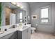 Bathroom featuring a large mirror, modern vanity, and a shower tub combo at 4020 Betsy Kerrison Pkwy, Johns Island, SC 29455
