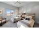 Bright bedroom featuring twin beds, neutral decor, and sun-filled windows at 4020 Betsy Kerrison Pkwy, Johns Island, SC 29455