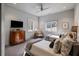 Neutral bedroom featuring two twin beds, a wooden dresser, and natural lighting at 4020 Betsy Kerrison Pkwy, Johns Island, SC 29455