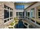 Unique courtyard with tranquil koi pond surrounded by stone and large windows at 4020 Betsy Kerrison Pkwy, Johns Island, SC 29455