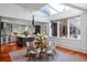 Bright dining area featuring skylight and open view of the gourmet kitchen at 4020 Betsy Kerrison Pkwy, Johns Island, SC 29455