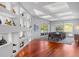 Bright dining room featuring a large wooden table, contemporary décor, and beautiful shelving at 4020 Betsy Kerrison Pkwy, Johns Island, SC 29455