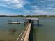 Waterfront property with private dock, pavilion, and boat lift offering direct access to the open water at 4020 Betsy Kerrison Pkwy, Johns Island, SC 29455