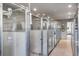Indoor kennels with metal fencing, feeding stations, and tile floors at 4020 Betsy Kerrison Pkwy, Johns Island, SC 29455