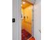 Residential elevator featuring wood paneling and red patterned carpet at 4020 Betsy Kerrison Pkwy, Johns Island, SC 29455