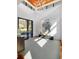 Bright foyer with soaring ceilings, striking light fixture, hardwood floors, and grand artwork at 4020 Betsy Kerrison Pkwy, Johns Island, SC 29455
