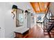 Grand foyer showcases a spiral staircase, wood ceiling, hardwood floors, and stylish lighting and mirror at 4020 Betsy Kerrison Pkwy, Johns Island, SC 29455