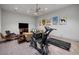 Home gym featuring treadmill, bike, TV, and room for exercising at 4020 Betsy Kerrison Pkwy, Johns Island, SC 29455