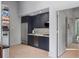 Modern kitchen features sleek navy cabinets, stainless steel appliances, and lots of storage space at 4020 Betsy Kerrison Pkwy, Johns Island, SC 29455