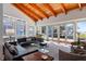 Bright living room with floor-to-ceiling windows with lovely views, a wooden ceiling, and neutral decor and furnishings at 4020 Betsy Kerrison Pkwy, Johns Island, SC 29455
