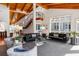 Bright and open living room featuring vaulted ceilings, a staircase, modern furniture, and large windows allowing for natural light at 4020 Betsy Kerrison Pkwy, Johns Island, SC 29455