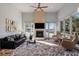 Bright living room with fireplace, TV, modern furniture, and beautiful views of outdoor space at 4020 Betsy Kerrison Pkwy, Johns Island, SC 29455