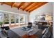 Expansive living room with hardwood floors, floor-to-ceiling windows, leather sofas, and views of the outside landscape at 4020 Betsy Kerrison Pkwy, Johns Island, SC 29455