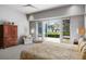Spacious main bedroom featuring a cozy sitting area and a beautiful view of the backyard and the lake at 4020 Betsy Kerrison Pkwy, Johns Island, SC 29455